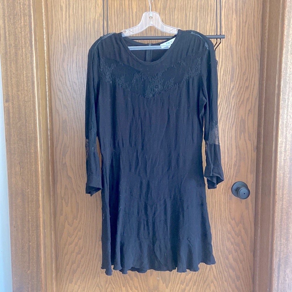 Black shift dress with lace cutouts